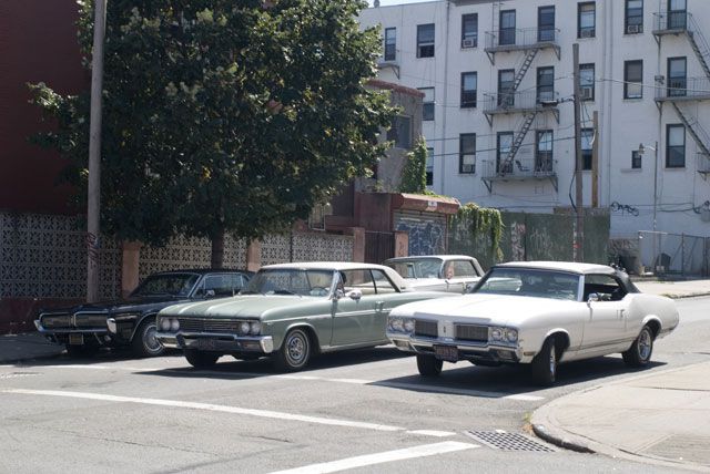 Some of the background cars. The Mercury Cougar had proper vintage California plates, while the rest had proper vintage New York plates, either real or prop.